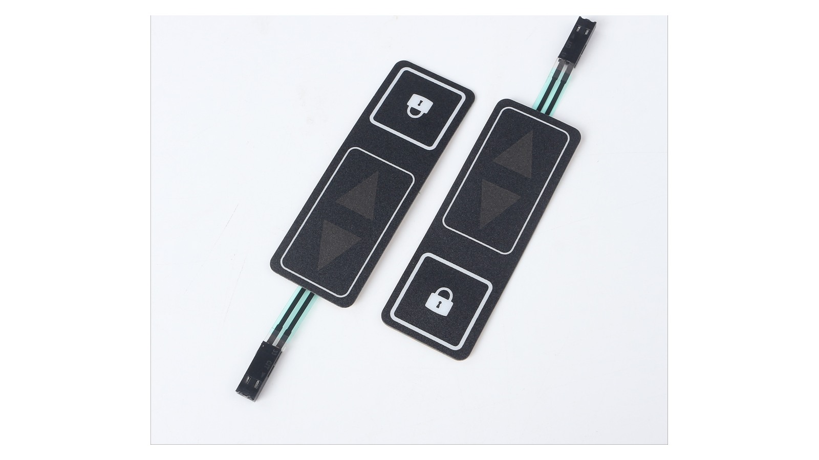 Real automotive membrane-switch control samples showing complete lock and unlock key areas, flexible tails and connectors