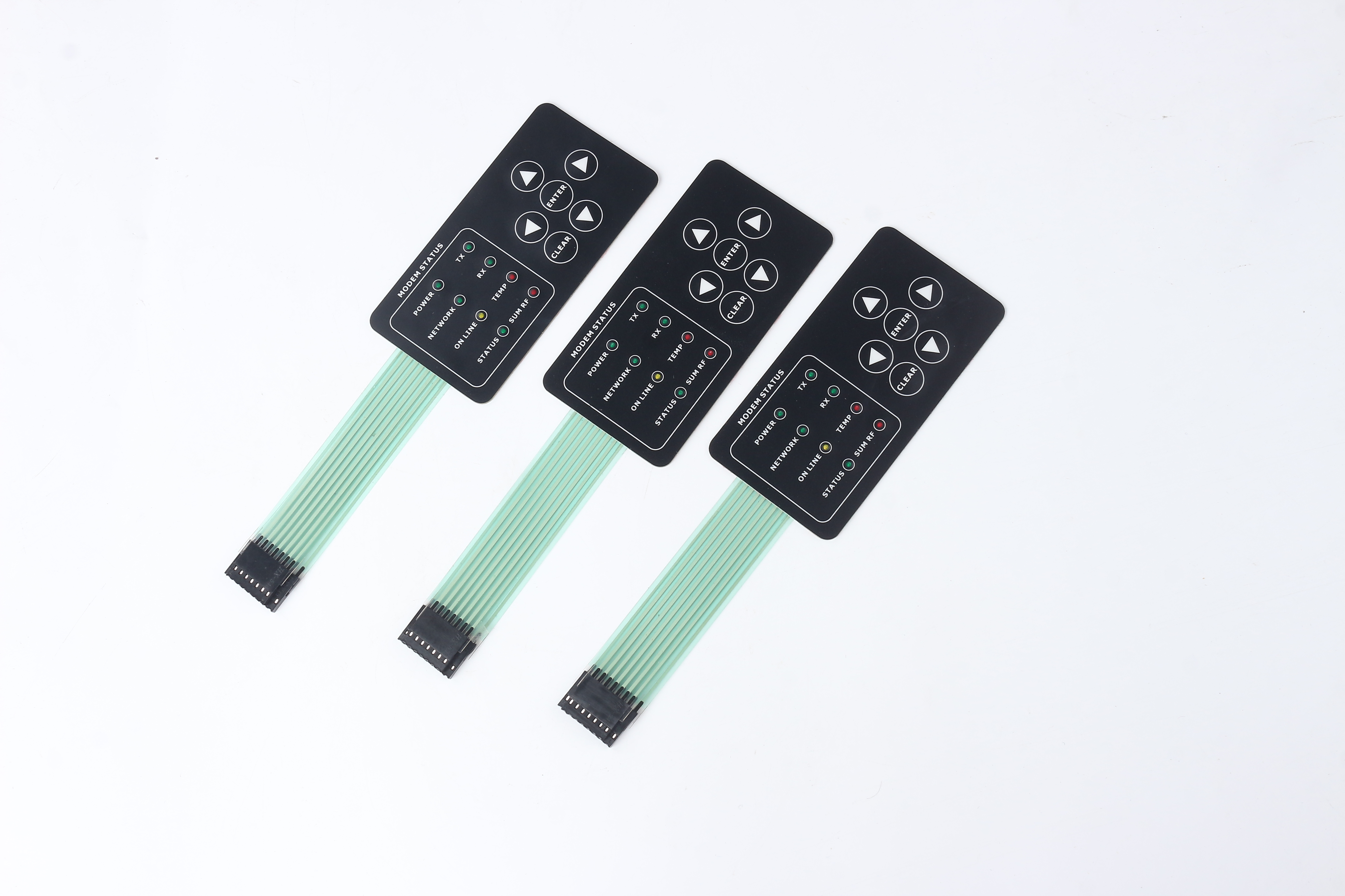 Three complete custom membrane keypad samples with status windows, directional service keys, full flexible tails and connector ends