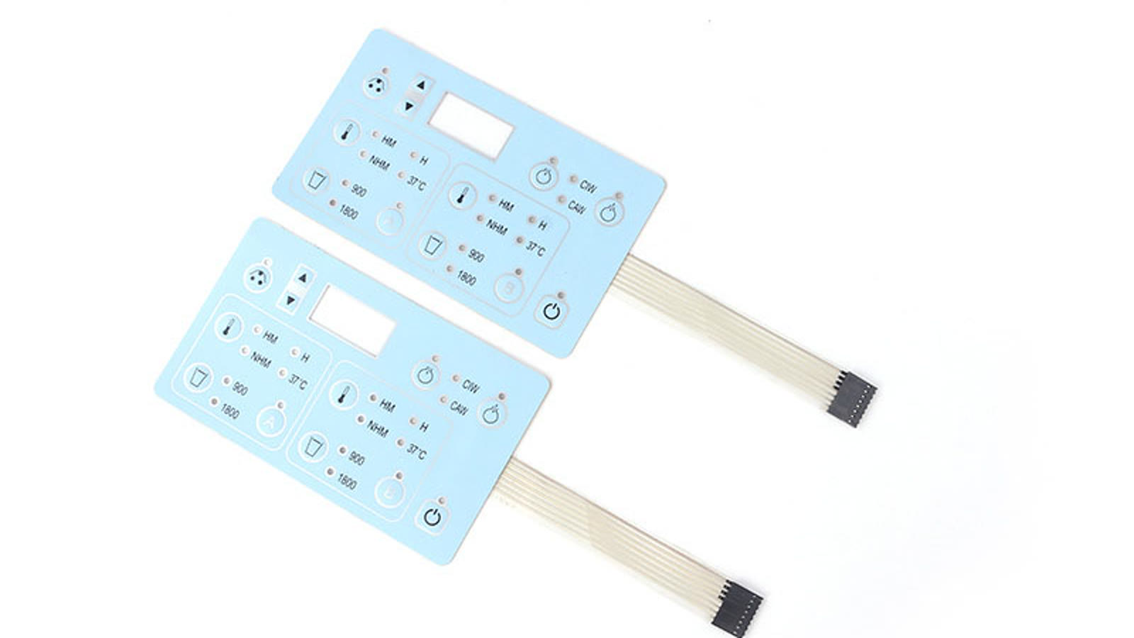 Real product crop showing two membrane switch panels with flexible tails for portable controller projects