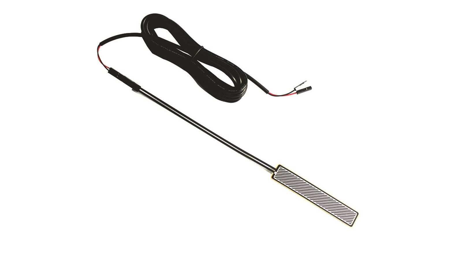 Real flexible pressure sensor sample showing a complete sensing strip, long tail, cable and electrical terminals
