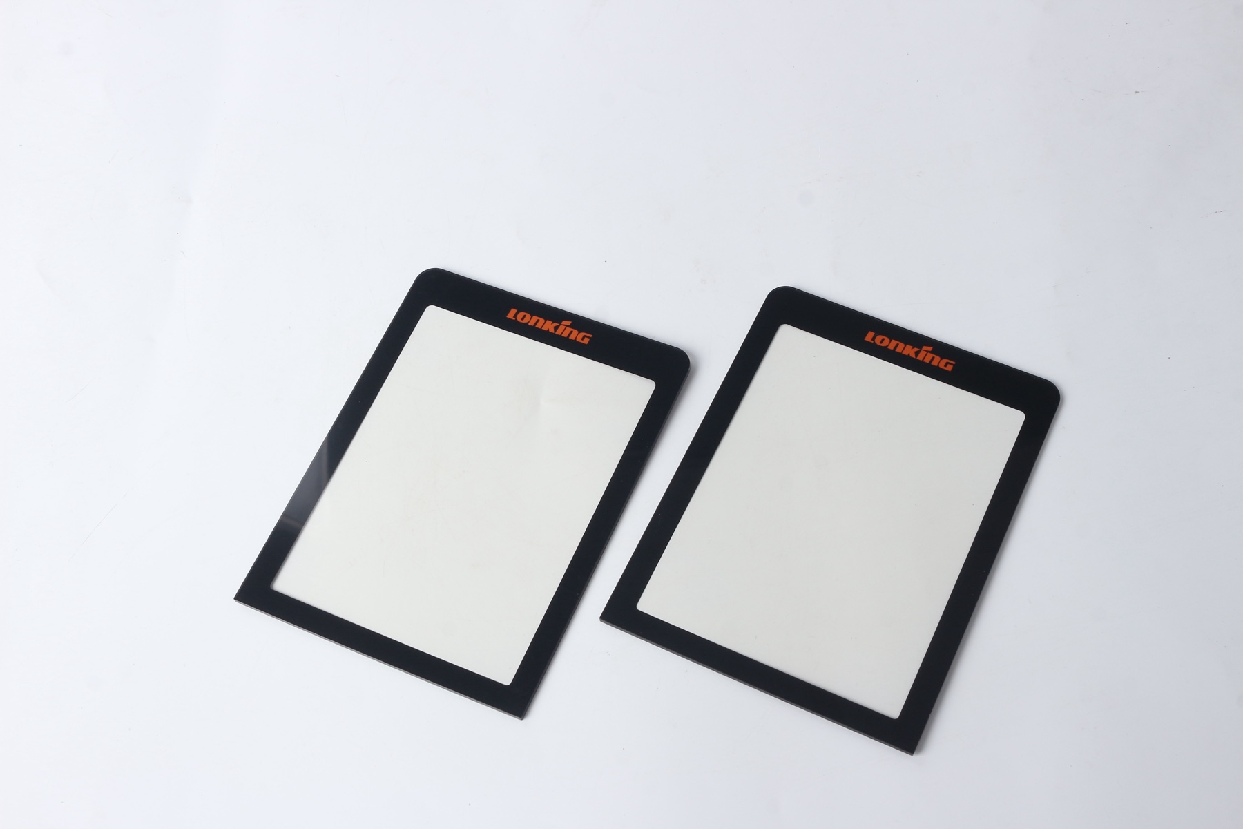 Graphic overlay with display window used for buyer checks on glare control, border masking, and edge bonding