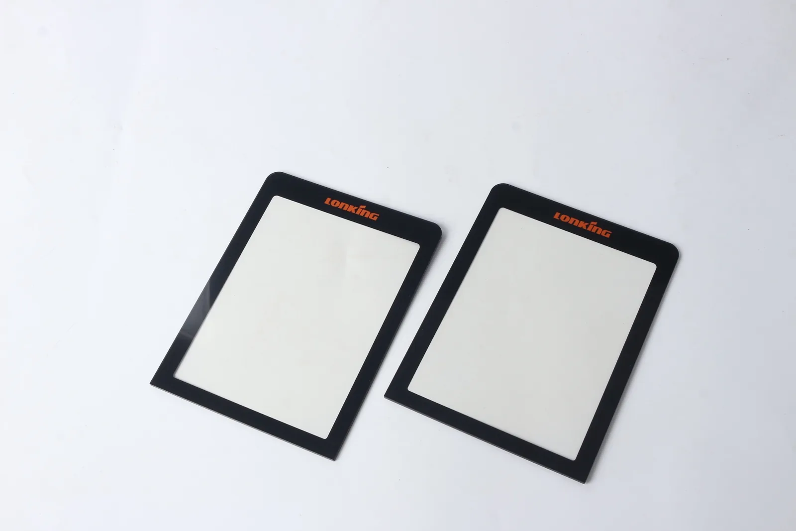 Graphic overlay with display window used for buyer checks on glare control, border masking, and edge bonding