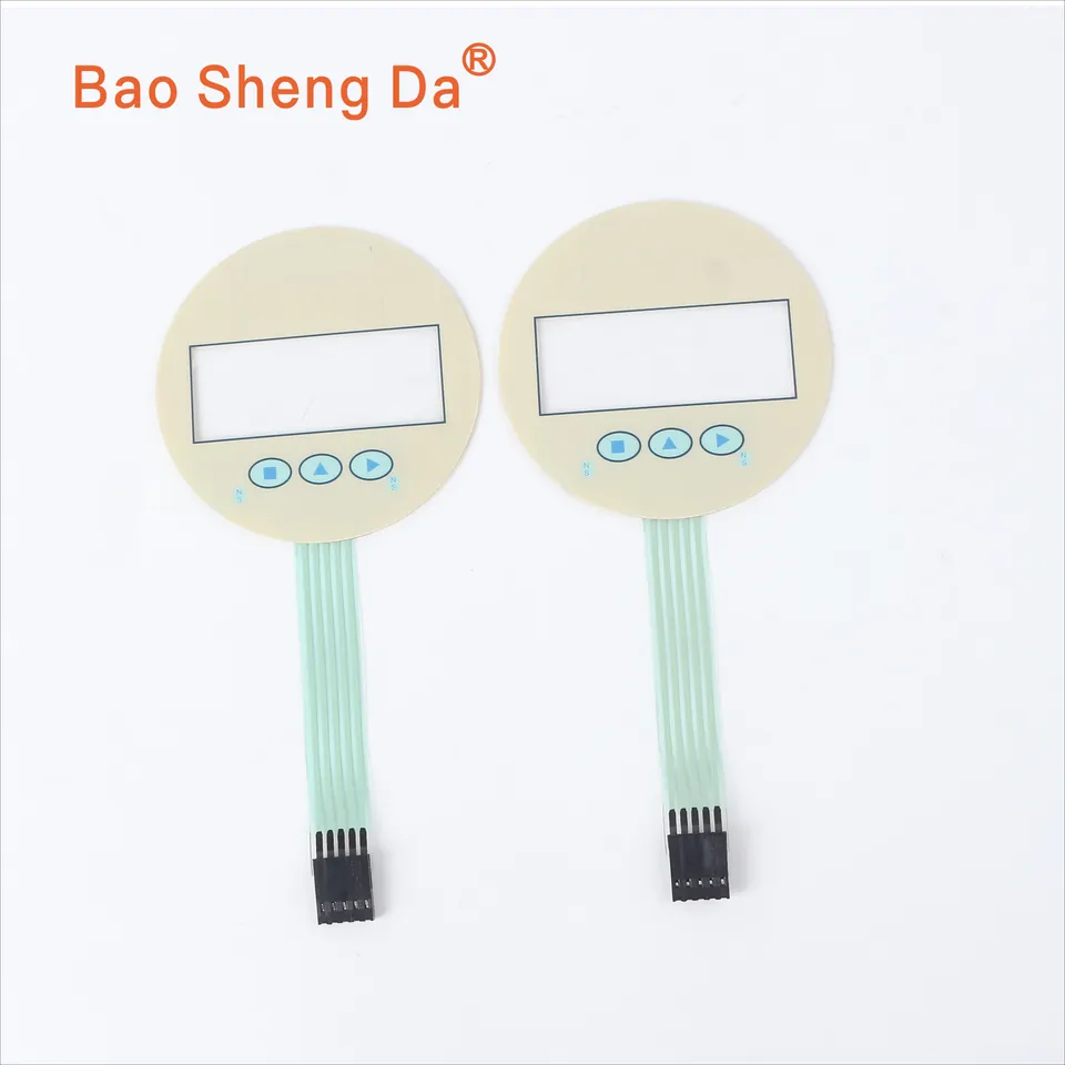 Two complete matching control-panel samples with printed faces, display windows, key zones, flexible tails and connectors
