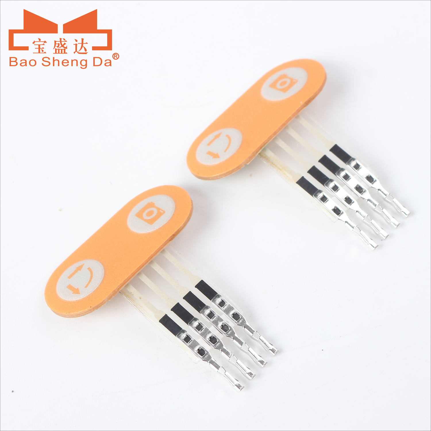 Two complete compact orange membrane switch modules with two key zones, short flex tails and terminal contacts