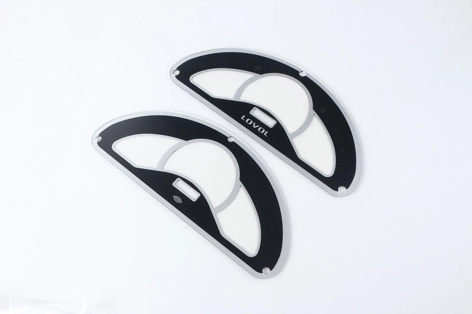 Two complete black instrument-cluster overlay samples with gauge scales, icon fields and display cutouts
