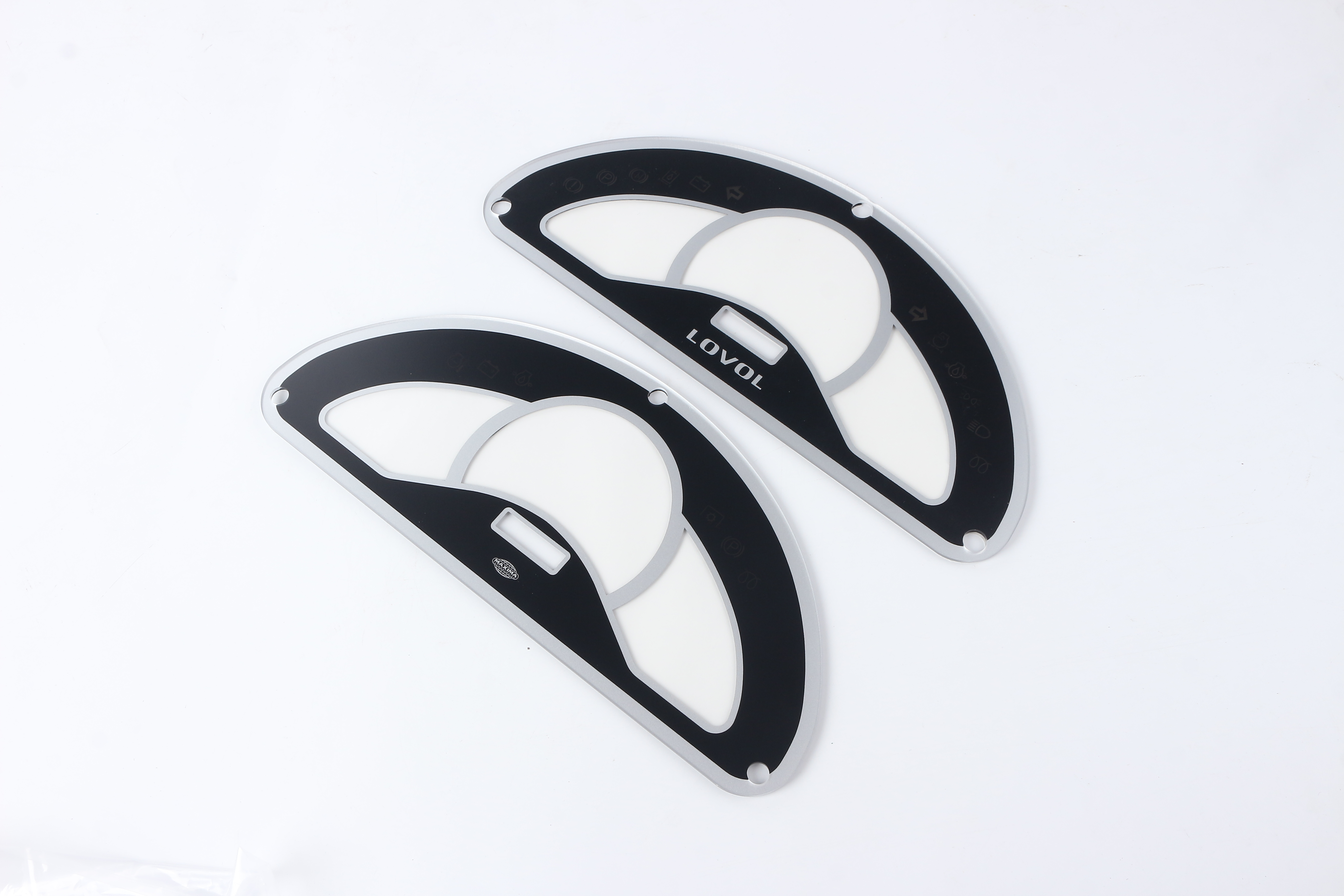 Two complete black instrument-cluster overlay samples with gauge scales, icon fields and display cutouts