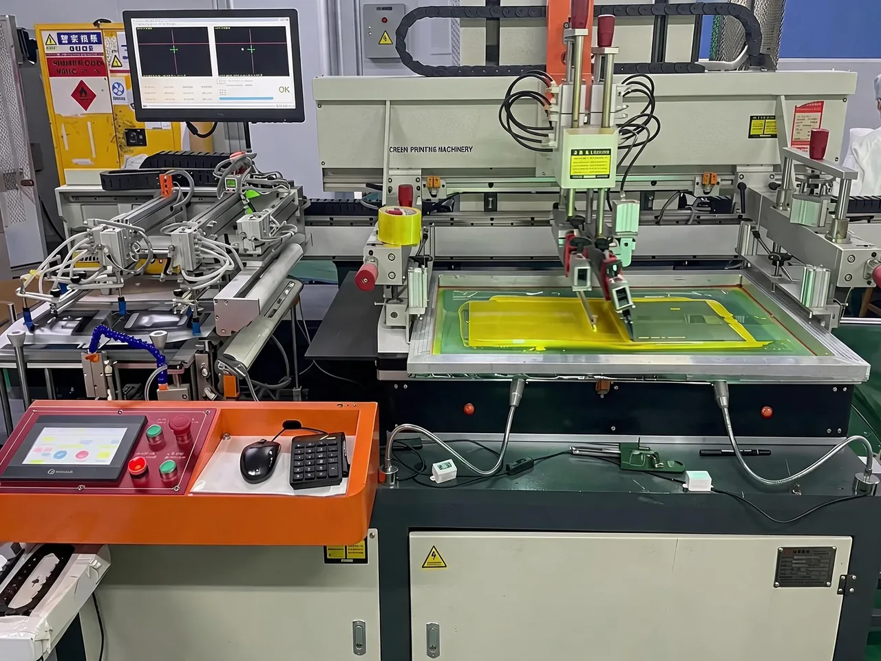 Screen-printing machinery with a printing screen and alignment display at Baoshengda